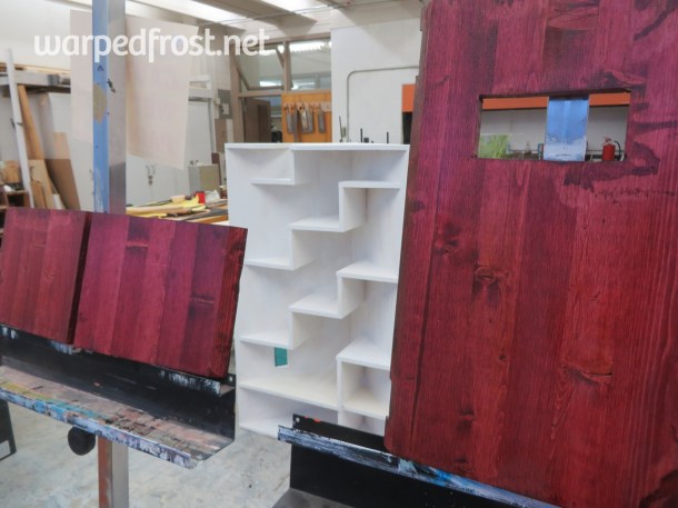 First I had to stain the doors, and put some polyurethane on them. In the background sits the primed bookshelf.