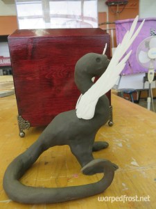 Made with self-hardening clay. The wings were from an old Wing Zero (from Gundam Wing) model kit.