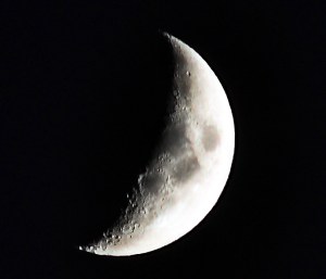 Photo of a crescent moon close to setting
