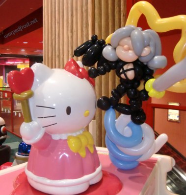 Balloon Seph next to a Hello Kitty figure