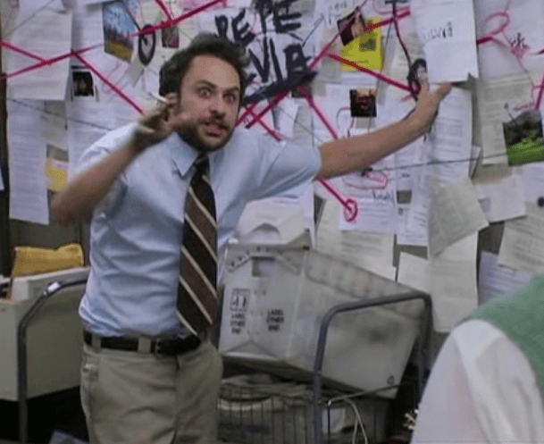 Charlie in front of the complicated bulletin board from It's Always Sunny In Philadelphia